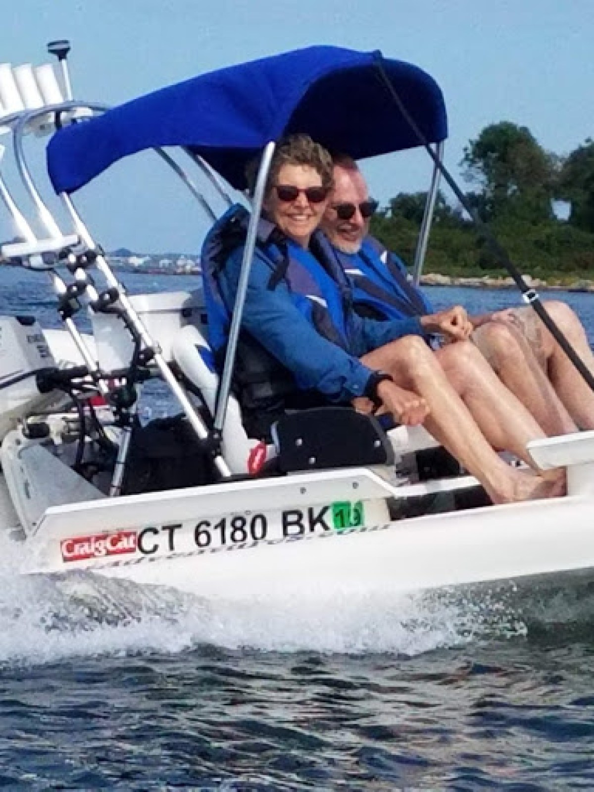 a group of people on a boat in the water